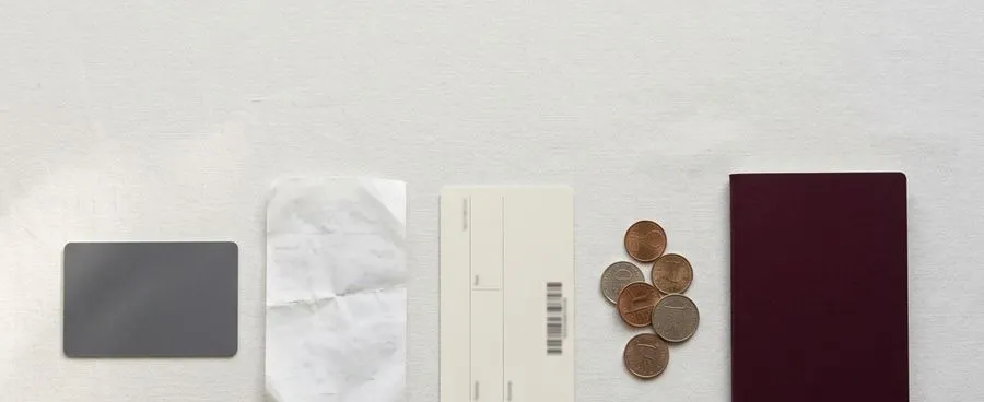 Five objects - a key card, a receipt, a boarding card, coins and a closed passport - representing five different honeymoon booking and payment paths.