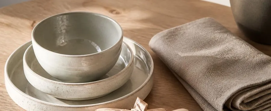 Home-goods gift items from a shared registry list on a plain wood table.